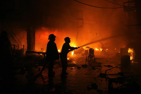 Police: Bomb near Pakistan intel office kills 12