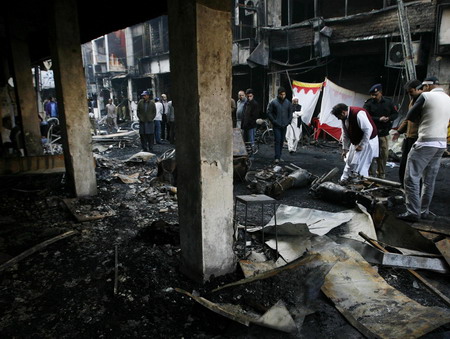 Police: Bomb near Pakistan intel office kills 12