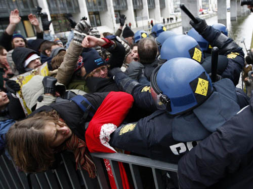 Police battle protesters at climate change conference