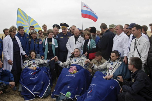 Russian-US space crew heads for Earth