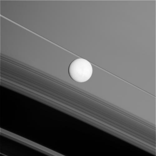 A close flyby of Saturn's mystery moon Enceladus