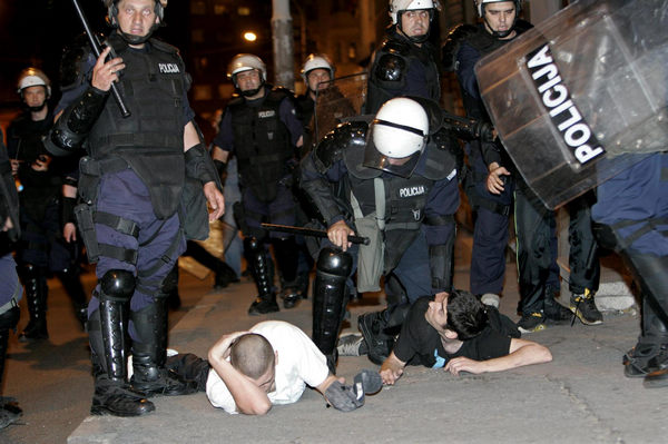 Serbian riot police arrest protesters during riots in Belgrade May 29, 2011. Clashes erupt in Belgrade to protest Mladic arrest