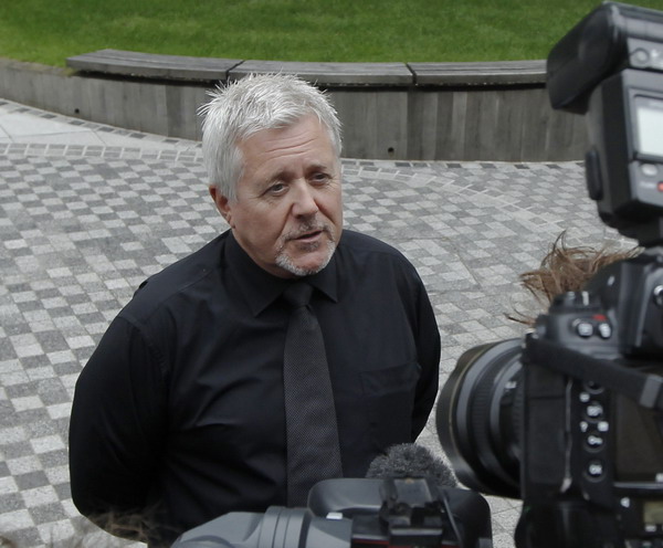 News of the World Chief sub-editor, Alan Edwards, speaks to the media outside the News International headquarters in London July 9, 2011. UK's News of the World bids farewell to readers