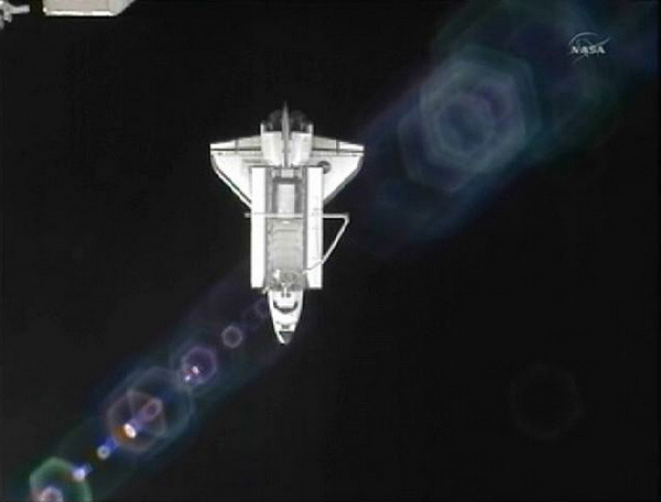 The US space shuttle Atlantis is seen with from the International Space Station as it departs the station in this still image taken from NASA TV on July 19, 2011. Atlantis lands at Kennedy Space Center