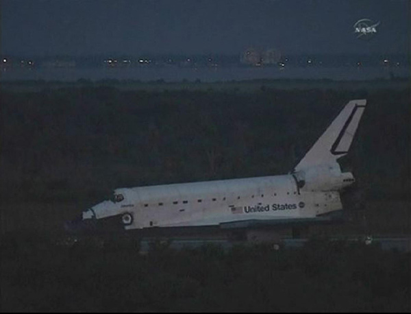 The space shuttle Atlantis sits on the runway in the early morning light after a night landing at the Kennedy Space Center in Florida in this image from NASA TV July 21, 2011. Atlantis lands at Kennedy Space Center