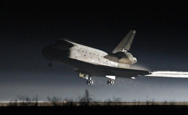 The space shuttle Atlantis lands at the Kennedy Space Center in Cape Canaveral, Florida, July 21, 2011. Atlantis lands at Kennedy Space Center