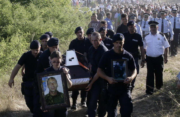 Members of the Kosovo special police unit carry the coffin during the funeral of Enver Zymber, a member of the Kosovo special police unit in the village of Dubovc, 20km north of Pristina July 27, 2011. Violence in north Kosovo draws EU warning