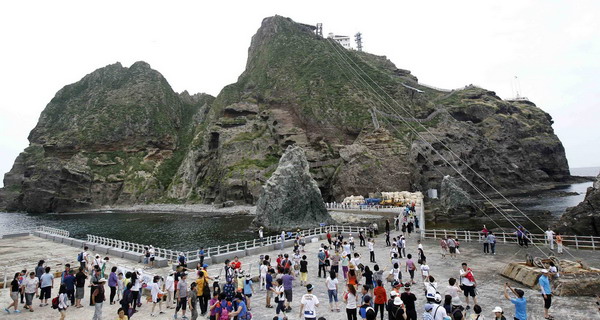 South Korean tourists visit Dokdo island, also known as Takeshima in Japanese, east of Seoul August 1, 2011. S Korea protests Japan's claim to disputed islets