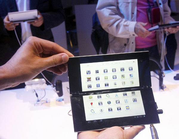Media scrutinize new Sony P tablet at the IFA consumer electronics fair in Berlin August 31, 2011. Sony tablets face tough sell on price, hardware