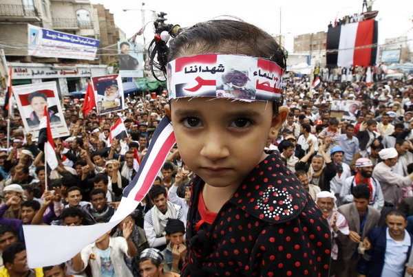 A girl attends an anti-government protest to demand the ouster of President Ali Abdullah Saleh in Sanaa Sept 26, 2011. Yemen protesters entrenched after Saleh disappoints