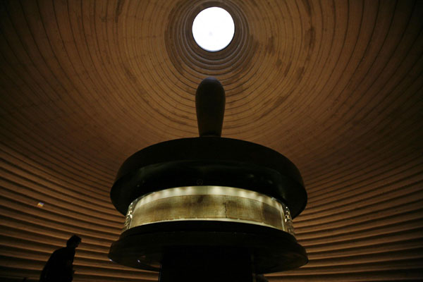 A visitor looks at a facsimile of the Isaiah Scroll, one of the Dead Sea Scrolls, displayed inside the Shrine of the Book at the Israel Museum in Jerusalem Sept 26, 2011. 2000-Year-Old Dead Sea Scrolls Go Online