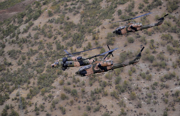 Turkish military helicopters fly over the Hakkari province during President Abdullah Gul's visit to southeastern Turkey on the Turkish-Iraqi border, October 15, 2011. Report: Turkey launches incursion into Iraq