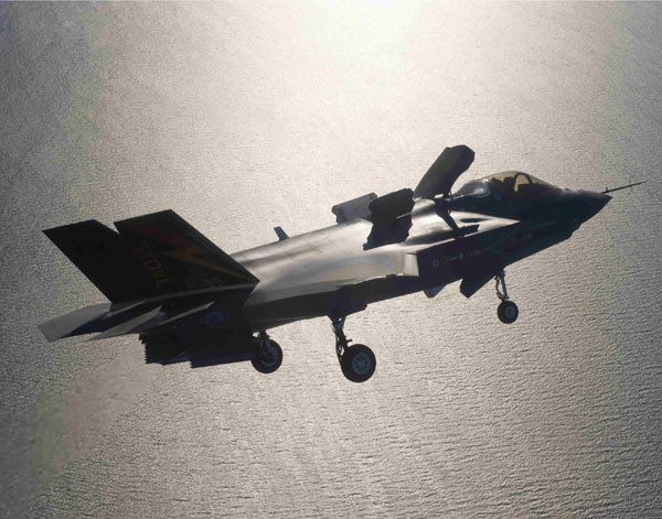 The 16-ton fighter jet slowed to a stop off the warship's port beam, where it hovered like a floating rock as thousands of pounds of thrust from its engine and lift fan stirred up a cloud of mist from the Atlantic Ocean 100 feet below. F-35 makes headway amid criticism