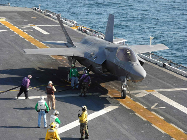 The 16-ton fighter jet slowed to a stop off the warship's port beam, where it hovered like a floating rock as thousands of pounds of thrust from its engine and lift fan stirred up a cloud of mist from the Atlantic Ocean 100 feet below. F-35 makes headway amid criticism