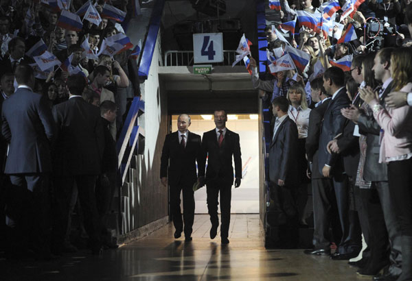 Russia's President Dmitry Medvedev (centre R) and Prime Minister Vladimir Putin (centre L) attend a United Russia party congress in Moscow November 27, 2011. Putin accepts presidential nomination
