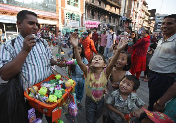 People celebrate the chariot festival for rain