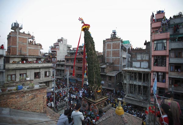People celebrate the chariot festival for rain