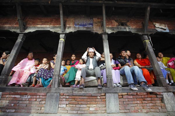 People celebrate the chariot festival for rain