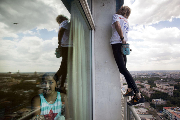Alain Robert of France, who is known as 'Spiderman', climbs the Habana Libre hotel in Havana Feb 4, 2013. 'French Spiderman' climbs landmark Havana hotel