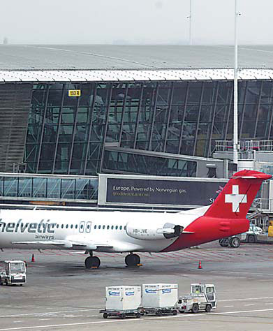 Baggage carts make their way past a Helvetic Airways aircraft from which millions' of dollars worth of diamonds were stolen on the tarmac of Brussels international airport on Tuesday. Yves Logghe / Associated Press $50m in diamonds stolen from Brussels airport