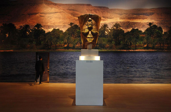 A museum staff walks through a door in the backdrop of Egypt's River Nile during a media preview of the Mummy: Secrets of the Tomb exhibition at the ArtScience Museum in Singapore April 25, 2013. Snapshots at Mummy: Secrets of the Tomb exhibition