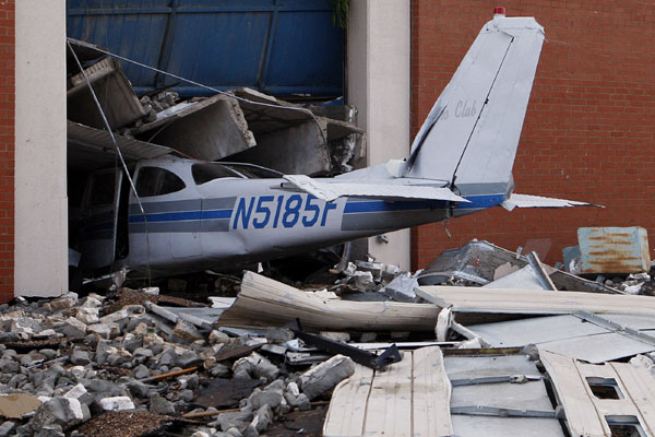 A tornado damaged airplane is pictured at Canadian Valley Technology Center's Aviation Technology building in El Reno, Oklahoma June 1, 2013. Oklahoma tornadoes kill at least nine