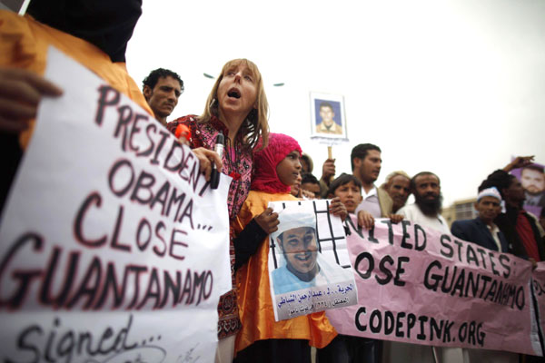 Human rights activists and relatives of Yemeni detainees at Guantanamo Bay prison shout slogans during a protest to demand the release of the detainees, outside the US embassy in Sanaa June 17, 2013. US names envoy to close Guantanamo