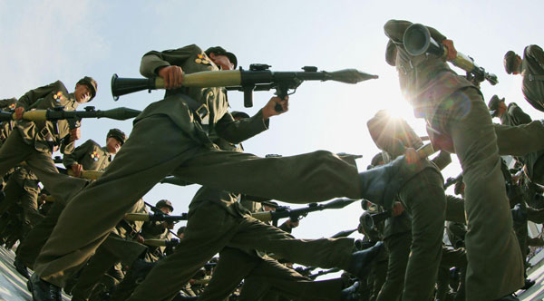 Worker-Peasant Red Guard members attend a parade marking the 1948 establishment of DPRK, in Pyongyang in this photo taken by Kyodo September 9, 2013. Parade marks the 1948 establishment of DPRK