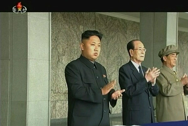 Kim Jong-un claps during a parade marking the 1948 establishment of DRPK, in Pyongyang in this still image taken from video released by KRT, state TV on September 9, 2013. Parade marks the 1948 establishment of DPRK