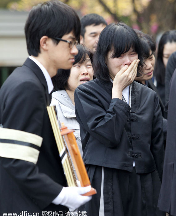 People suffer in funeral for victims, South Korea
