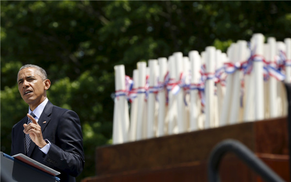 Obama tells Coast Guard grads climate change threatens US