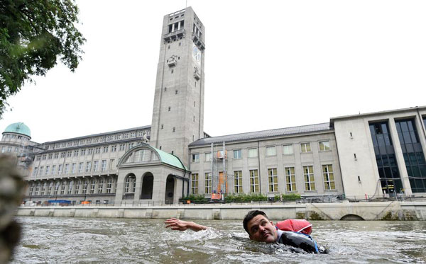 Sick of congested roads, German man swims to work